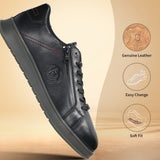 Black leather sneakers by bugatti with side zipper, decorative stitching, and textured rubber sole.
