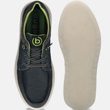 Black comfort sneakers by bugatti, showing a textured upper, green trim, and patterned off-white sole.