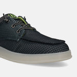 Black comfort sneaker by bugatti with a textured, patterned upper and off-white sole.
