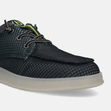 Black comfort sneaker by bugatti with a textured, patterned upper and off-white sole.