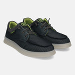 Black comfort sneakers by Bugatti, with a textured pattern, gray trim, and neon green accents.