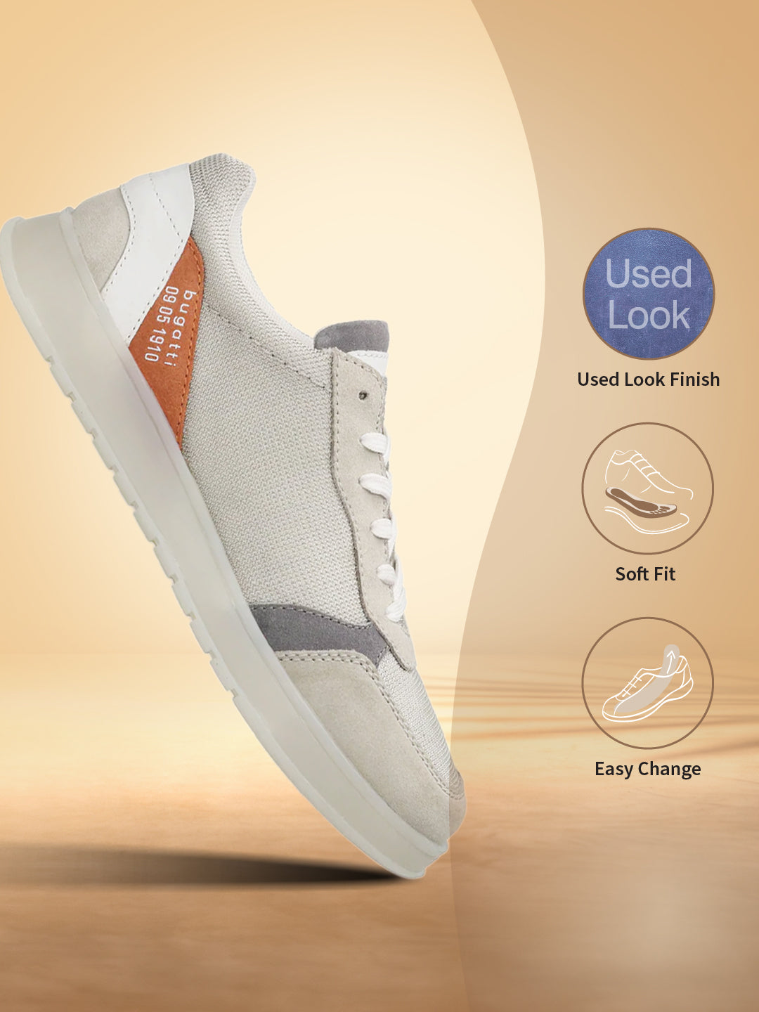 Grey comfort sneakers by bugatti with white laces, grey suede panels, and light sole.