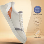 Grey comfort sneakers by bugatti with white laces, grey suede panels, and light sole.