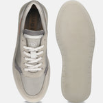 Grey casual sneaker by bugatti with white laces and a textured rubber sole.