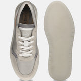 Grey casual sneaker by bugatti with white laces and a textured rubber sole.