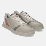 Grey sneakers by bugatti with suede and mesh panels, white laces, and a chunky sole.
