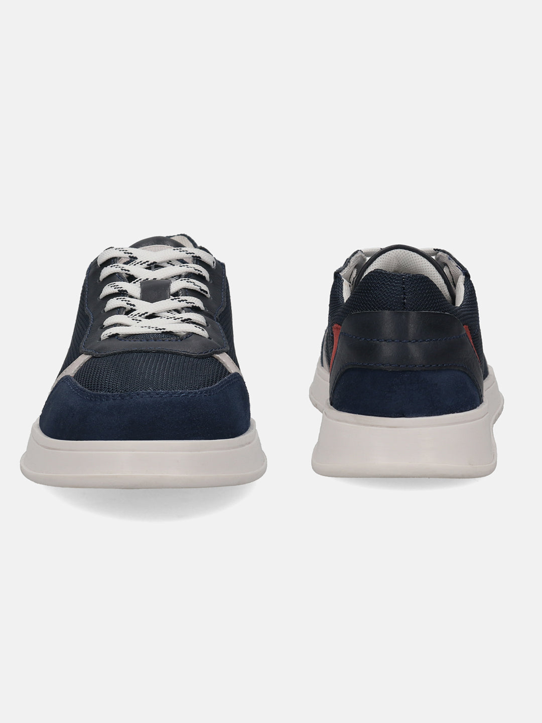 Dark blue sneakers by bugatti with white laces, a suede toe cap, and a contrasting white sole.