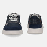 Dark blue sneakers by bugatti with white laces, a suede toe cap, and a contrasting white sole.
