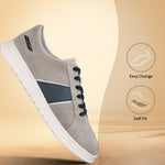 Grey premium leather sneakers by bugatti with navy blue accents, white soles, and black laces.