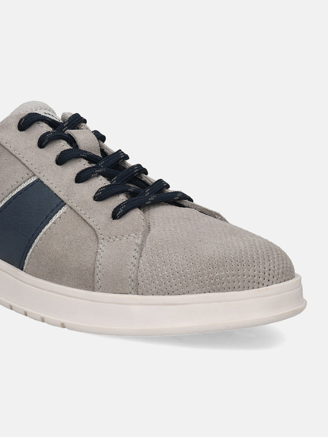 Grey suede sneaker by bugatti, with navy laces and perforated toebox.