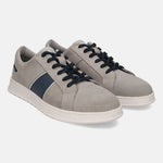 Grey leather sneakers by bugatti, featuring navy blue stripes and black laces, with a perforated toe.
