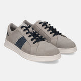 Grey leather sneakers by bugatti, featuring navy blue stripes and black laces, with a perforated toe.