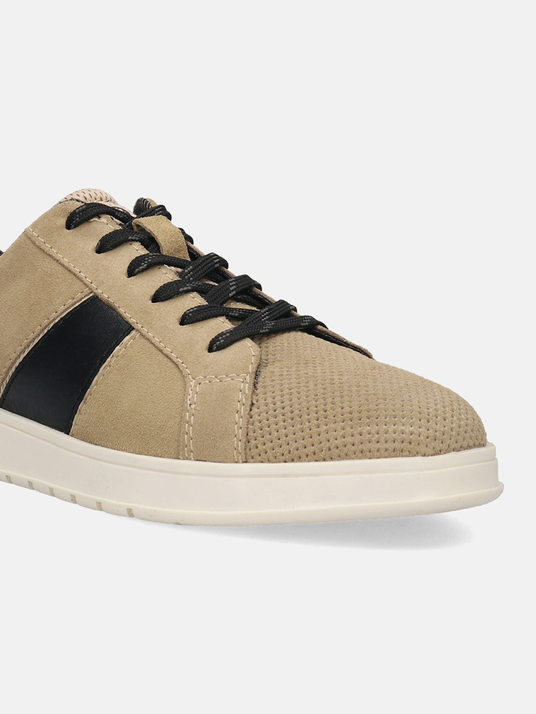 Beige leather sneakers by bugatti, with black side stripe, perforated toe, and black laces.