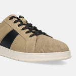 Beige leather sneakers by bugatti, with black side stripe, perforated toe, and black laces.