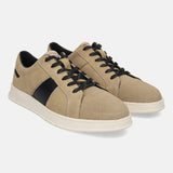 Beige leather sneakers by Bugatti with a black side stripe and black laces.