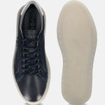 Dark blue leather sneakers by bugatti, shown with contrasting white sole and laces.