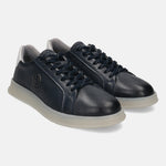 Dark blue leather sneakers by Bugatti, with a light gray rubber sole and dark blue laces.