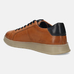 Cognac leather sneaker by bugatti with black heel detail and tan sole, shown in a rear angle view.