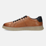 Cognac leather sneaker by bugatti with black laces and dark blue heel detail.