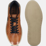 Cognac premium leather comfort sneakers by bugatti, displaying the sole with a textured pattern.