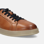 Cognac leather sneakers by bugatti, featuring dark laces and a contrasting light tan sole.