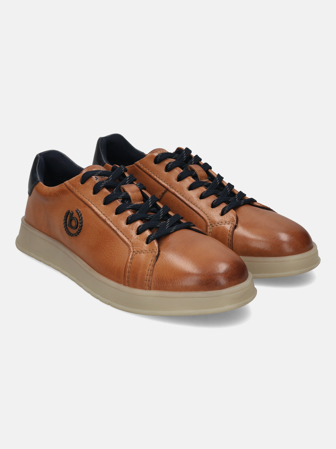 Cognac leather sneakers by bugatti with dark blue laces and collar detail, on a light beige sole.