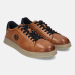 Cognac leather sneakers by bugatti with dark blue laces and collar detail, on a light beige sole.