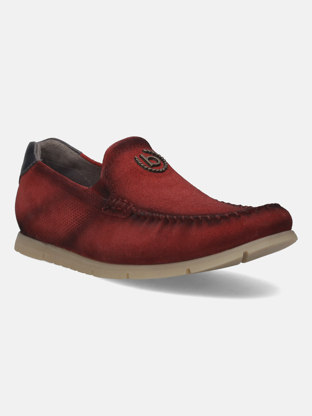 Red leather slip-on shoe by bugatti, featuring moccasin stitching and a metal logo detail.