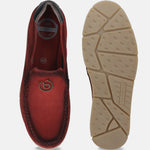 Red leather casual slip-ons by bugatti, featuring cushioned insoles and a patterned rubber sole.