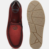 Red leather casual slip-ons by bugatti, featuring cushioned insoles and a patterned rubber sole.