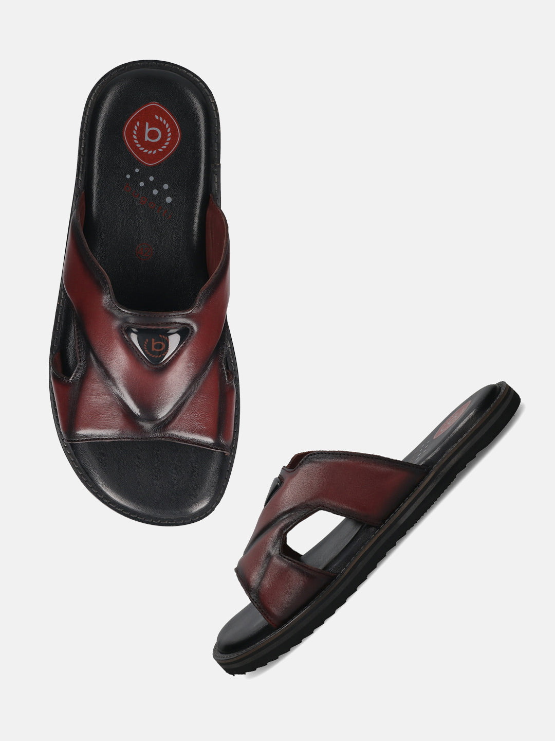 A grey Men's bugatti Mules featuring a round toe plain toe, zero heels heel, and a wide fit. Made from premium genuine leather with a durable eva outsole, this slip-on design offers both style and comfort.