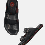 A black Men's bugatti Mules featuring a round toe plain toe, zero heels heel. Made from premium genuine leather with a durable eva outsole, this slip-on design offers both style and comfort.