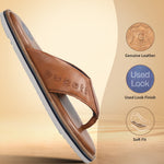 Brown leather thong sandals by bugatti with a white and blue sole.