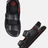 bugatti Cobie black sandals in premium leather with a comfort back strap, shown at an angle.

