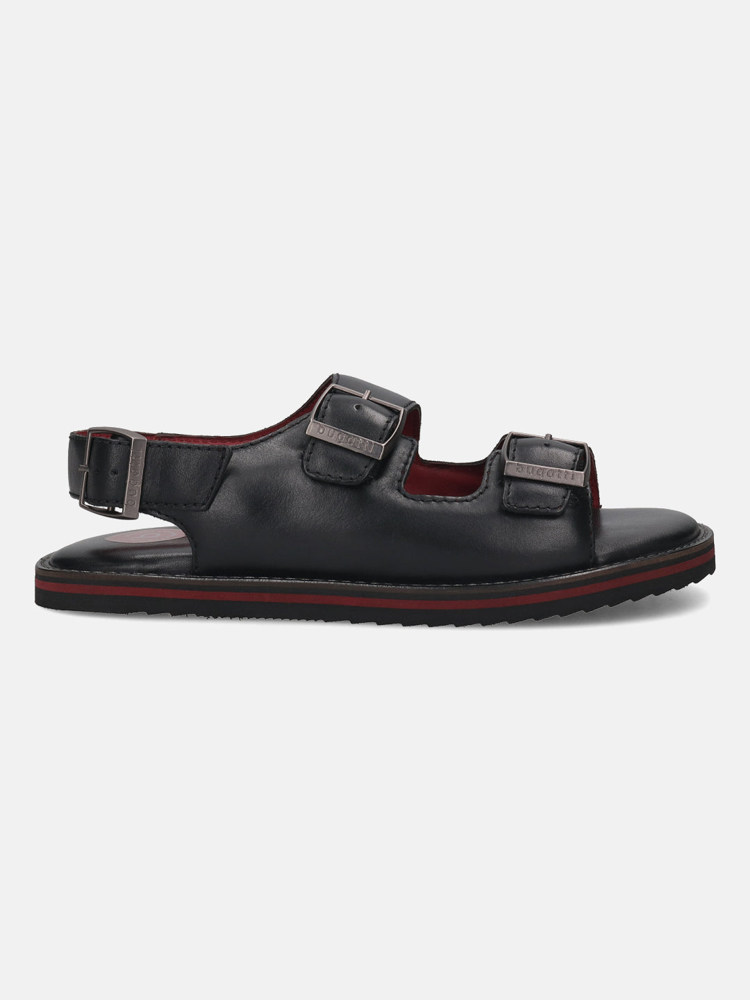 Side view of a black leather bugatti sandal with two buckled straps and red stripe detail.
