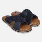 bugatti Cobie sandals in dark blue, featuring cross straps with a suede texture and a brown footbed.
