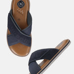 Bugatti Cobie sandals in dark blue, featuring cross straps with the brand name, a brown sole, and grey trim.
