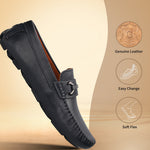 Dark blue leather slip-on shoe by bugatti with a metal accent and stitched seams.