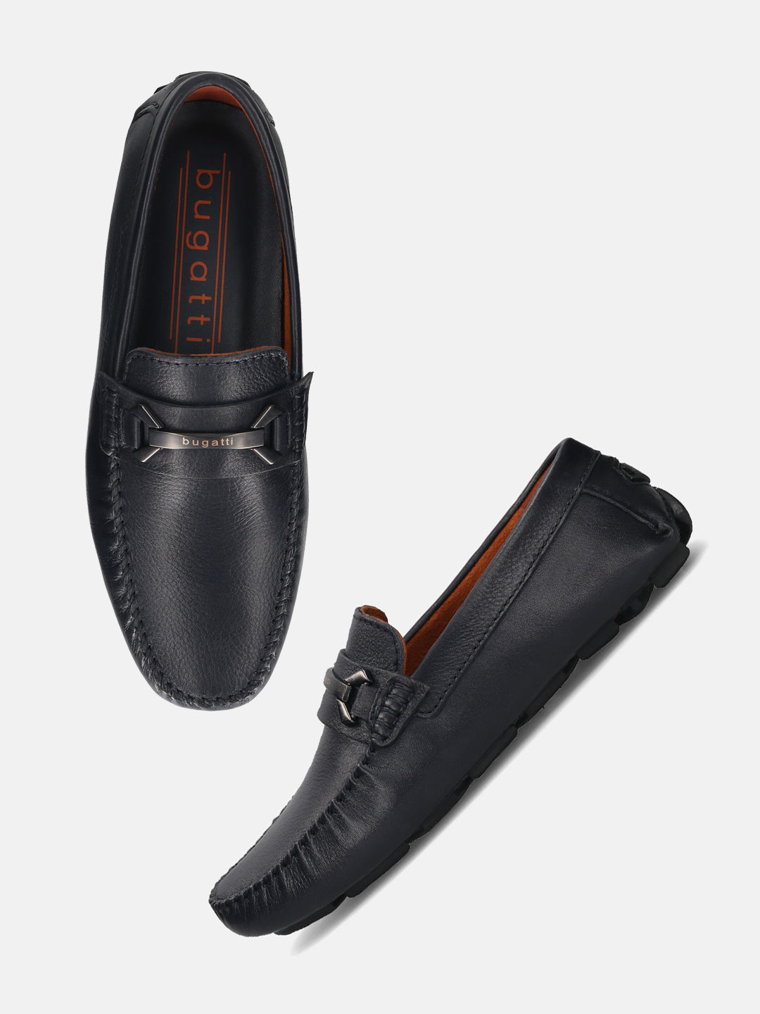 Dark blue leather slip-on shoes by bugatti with a silver-toned decorative strap.