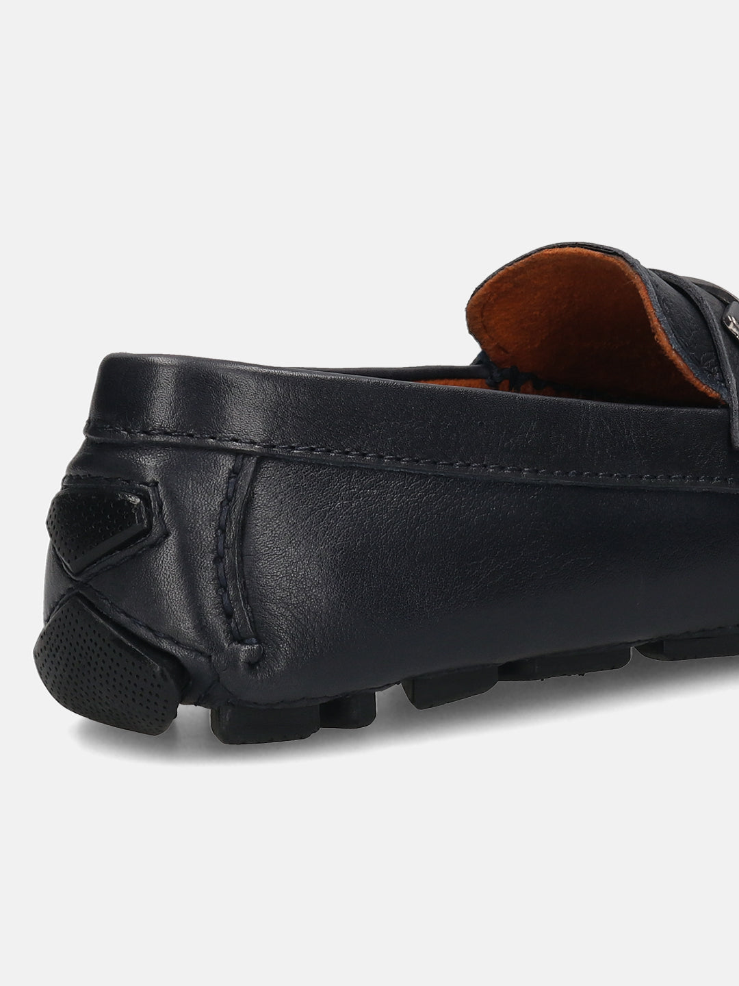 Dark blue leather slip-on shoe by bugatti, showing the heel and sole.