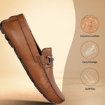 Cognac leather slip-on shoe by bugatti, featuring metal hardware and decorative stitching.