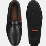 Dark green leather slip-on shoes by bugatti, showing the top and sole with black and orange accents.