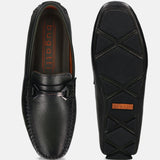 Dark green leather slip-on shoes by bugatti, showing the top and sole with black and orange accents.