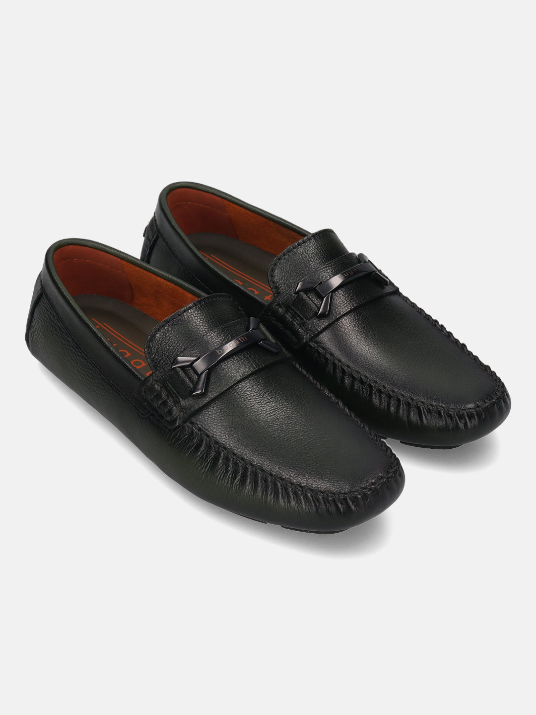 Dark green leather slip-on shoes by bugatti with a stitched toe and metallic accent piece.