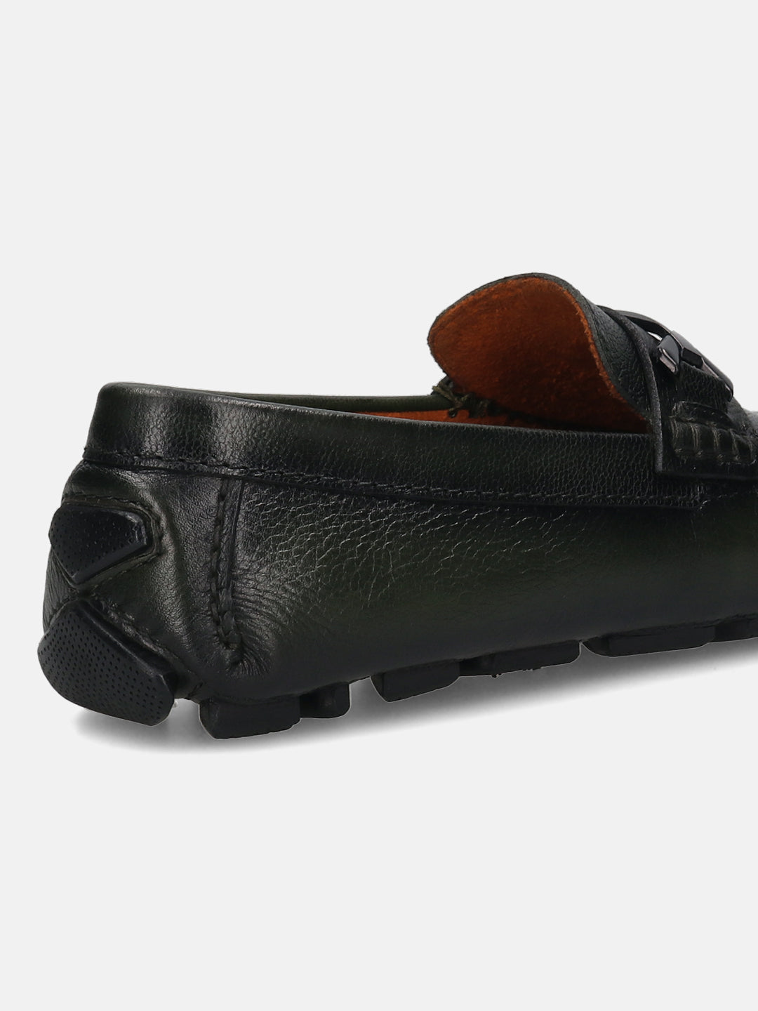 Dark green leather loafer by Bugatti, featuring a textured upper and a rubber sole with grip.