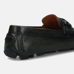 Dark green leather loafer by Bugatti, featuring a textured upper and a rubber sole with grip.