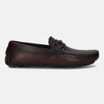 Bordeaux leather slip-on casual shoe by bugatti, featuring a metal accent piece on the upper and a textured outsole.
