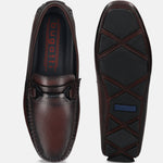 Bordeaux leather slip-on shoes by bugatti with stitched detailing and rubber soles, shown from above and below.