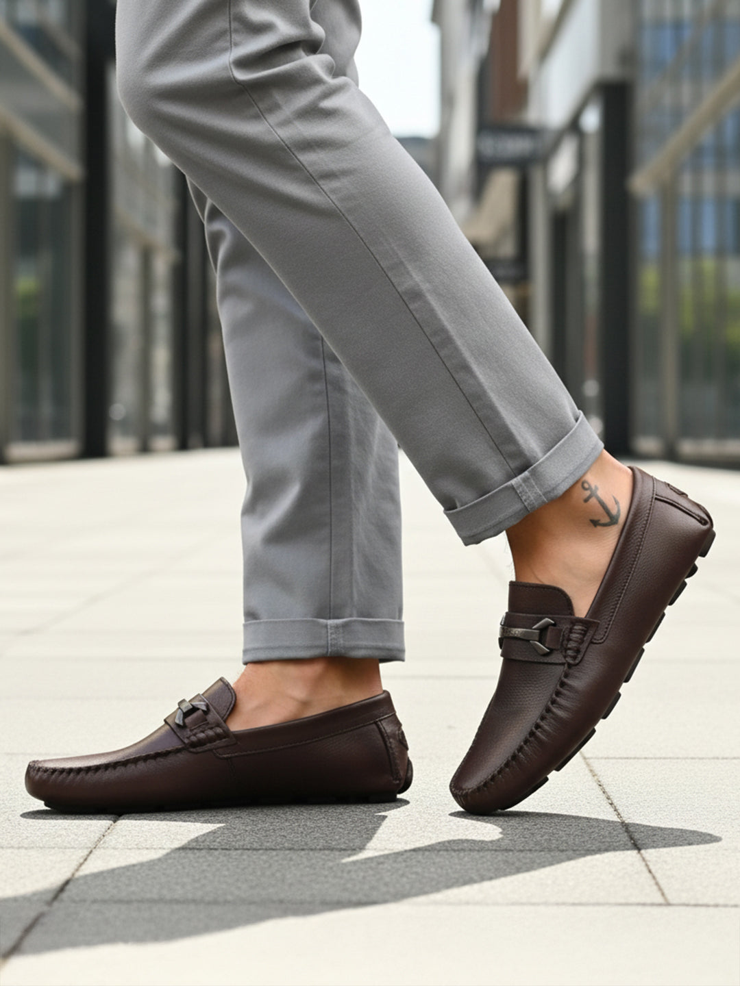 Bugatti Olexa bordo slip-on shoes in brown premium leather, featuring a decorative metal accent and rubber soles.
