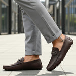 Bugatti Olexa bordo slip-on shoes in brown premium leather, featuring a decorative metal accent and rubber soles.
